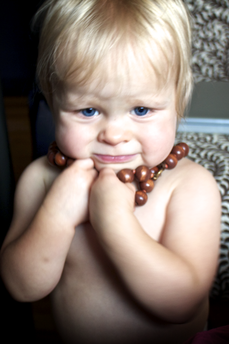 playing with a necklace